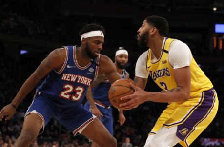 NEW YORK, NEW YORK - JANUARY 22: (NEW YORK DAILIES OUT) Anthony Davis #3 of the Los Angeles Lakers in action against Mitchell Robinson #23 of the New York Knicks at Madison Square Garden on January 22, 2020 in New York City. The Lakers defeated the Knicks 100-92. NOTE TO USER: User expressly acknowledges and agrees that, by downloading and or using this photograph, User is co<em></em>nsenting to the terms and co<em></em>nditions of the Getty Images License Agreement. (Photo by Jim McIsaac/Getty Images)