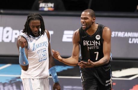 NEW YORK, NEW YORK - APRIL 10: Kevin Durant #7 of the Brooklyn Nets reacts after the out of bounds ball was giving to Los Angeles Lakers as Mo<em></em>ntrezl Harrell #15 of the Los Angeles Lakers looks on in the fourth quarter at Barclays Center on April 10, 2021 in the Brooklyn borough of New York City.NOTE TO USER: User expressly acknowledges and agrees that, by downloading and or using this photograph, User is co<em></em>nsenting to the terms and co<em></em>nditions of the Getty Images License Agreement. (Photo by Elsa/Getty Images)