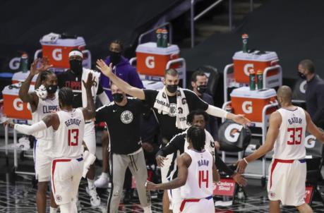 LOS ANGELES, CALIFORNIA - APRIL 06: The LA Clippers celebrate during a time out against the Portland Trail Blazers at Staples Center on April 06, 2021 in Los Angeles, California. NOTE TO USER: User expressly acknowledges and agrees that, by downloading and or using this photograph, User is co<em></em>nsenting to the terms and co<em></em>nditions of the Getty Images License Agreement. (Photo by Meg Oliphant/Getty Images)