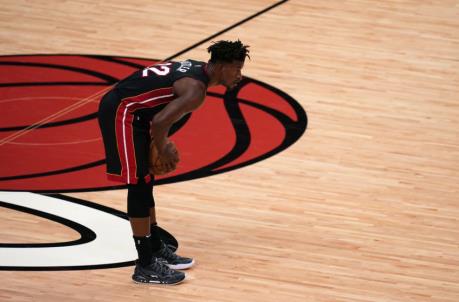 Miami Heat forward Jimmy Butler (22) holds the ball at mid court against the Chicago Bulls
(Jasen Vinlove-USA TODAY Sports)