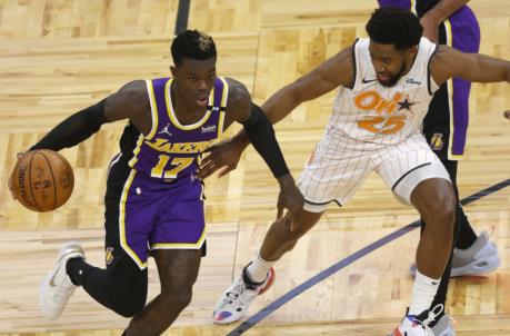 Apr 26, 2021; Orlando, Florida, USA;Los Angeles Lakers guard Dennis Schroder (17) drives to the basket as Orlando Magic guard Chasson Randle (25) defends during the first quarter at Amway Center. Mandatory Credit: Kim Klement-USA TODAY Sports