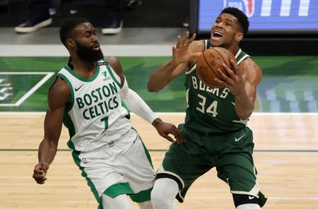 MILWAUKEE, WISCo<em></em>nSIN - MARCH 24: Giannis Antetokounmpo #34 of the Milwaukee Bucks is defended by Jaylen Brown #7 of the Boston Celtics during the second half of a game at Fiserv Forum on March 24, 2021 in Milwaukee, Wisconsin. NOTE TO USER: User expressly acknowledges and agrees that, by downloading and or using this photograph, User is co<em></em>nsenting to the terms and co<em></em>nditions of the Getty Images License Agreement. (Photo by Stacy Revere/Getty Images)