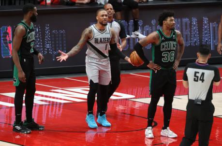 PORTLAND, OREGON - APRIL 13: Damian Lillard #0 of the Portland Trail Blazers reacts in the fourth quarter against the Boston Celtics at Moda Center on April 13, 2021 in Portland, Oregon. NOTE TO USER: User expressly acknowledges and agrees that, by downloading and or using this photograph, User is co<em></em>nsenting to the terms and co<em></em>nditions of the Getty Images License Agreement. (Photo by Abbie Parr/Getty Images)