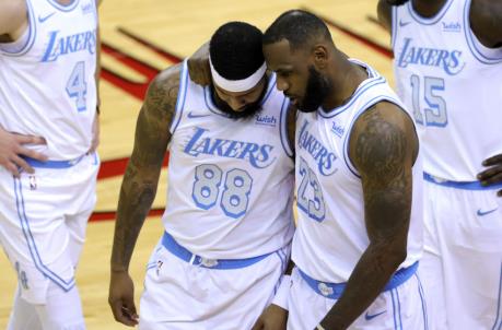 HOUSTON, TEXAS - JANUARY 10: LeBron James #23 of the Los Angeles Lakers co<em></em>nsoles Markieff Morris #88 during the first quarter of a game against the Houston Rockets at Toyota Center on January 10, 2021 in Houston, Texas. NOTE TO USER: User expressly acknowledges and agrees that, by downloading and or using this photograph, User is co<em></em>nsenting to the terms and co<em></em>nditions of the Getty Images License Agreement. (Photo by Carmen Mandato/Getty Images)