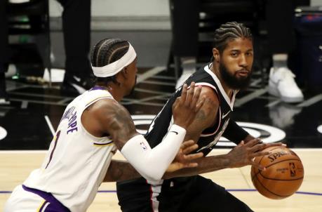 LOS ANGELES, CALIFORNIA - APRIL 04: Paul George #13 of the Los Angeles Clippers handles the ball against Kentavious Caldwell-Pope #1 of the Los Angeles Lakers (Photo by Katelyn Mulcahy/Getty Images)