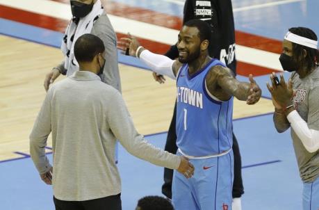 John Wall #1 of the Houston Rockets hugs head coach Stephen Silas (Photo by Bob Levey/Getty Images)