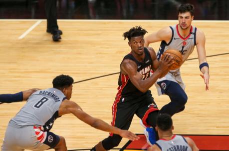 Miami Heat forward Jimmy Butler (22) looks on while dribbling around Washington Wizards forward Rui Hachimura (8)
(Sam Navarro-USA TODAY Sports)