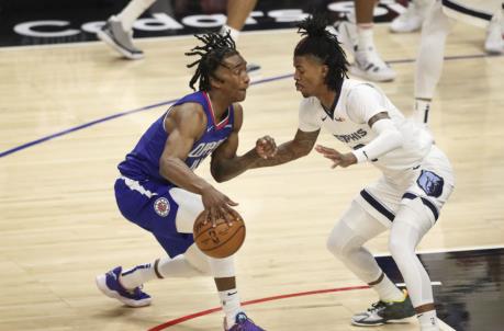 LOS ANGELES, CALIFORNIA - APRIL 21: Terance Mann #14 of the LA Clippers handles the ball defended by Ja Morant #12 of the Memphis Grizzlies at Staples Center on April 21, 2021 in Los Angeles, California. NOTE TO USER: User expressly acknowledges and agrees that, by downloading and or using this photograph, User is co<em></em>nsenting to the terms and co<em></em>nditions of the Getty Images License Agreement. (Photo by Meg Oliphant/Getty Images)