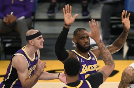 LOS ANGELES, CALIFORNIA - JANUARY 15: LeBron James #23 of the Los Angeles Lakers celebrates a basket with Anthony Davis #3 and Alex Caruso #4 during the first half against the New Orleans Pelicans at Staples Center on January 15, 2021 in Los Angeles, California. (Photo by Harry How/Getty Images)