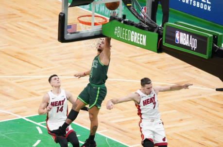 Boston Celtics guard Carsen Edwards (4) steals the ball and drives to the basket for two points against Miami Heat guard Tyler Herro (14) and guard Goran Dragic (7)
(David Butler II-USA TODAY Sports)