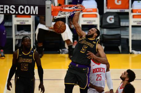 May 12, 2021; Los Angeles, California, USA; Los Angeles Lakers guard Talen Horton-Tucker (5) dunks for a basket against the Houston Rockets during the first half at Staples Center. Mandatory Credit: Gary A. Vasquez-USA TODAY Sports