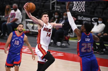 Miami Heat guard Tyler Herro (14) goes up for a slam dunk as Detroit Pistons forward Tyler Cook (25) attempts to defend
(Tim Fuller-USA TODAY Sports)