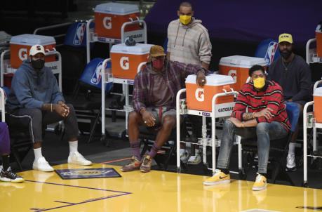 LOS ANGELES, CA - APRIL 15: Injured Los Angeles Lakers players Andre Drummond #2, LeBron James #23, Jared Dudley #10, Anthony Davis #3, and Markieff Morris #88 of the Los Angeles Lakers follow the action from the bench during the basketball game game against the Boston Celtics at Staples Center on April 15, 2021 in Los Angeles, California. NOTE TO USER: User expressly acknowledges and agrees that, by downloading and or using this photograph, User is co<em></em>nsenting to the terms and co<em></em>nditions of the Getty Images License Agreement. (Photo by Kevork Djansezian/Getty Images)