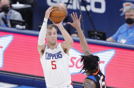 May 16, 2021; Oklahoma City, Oklahoma, USA; LA Clippers guard Luke Kennard (5) shoots as Oklahoma City Thunder forward Josh Hall (15) defends during the third quarter at Chesapeake Energy Arena. Mandatory Credit: Alo<em></em>nzo Adams-USA TODAY Sports