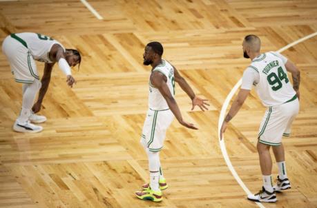 BOSTON, MASSACHUSETTS - MAY 18: Kemba Walker #8 of the Boston Celtics reacts with Evan Fournier #94 during the second half of a game in the play-in tournament against the Washington Wizards at TD Garden on May 18, 2021 in Boston, Massachusetts. NOTE TO USER: User expressly acknowledges and agrees that, by downloading and or using this photograph, User is co<em></em>nsenting to the terms and co<em></em>nditions of the Getty Images License Agreement. (Photo by Maddie Malhotra/Getty Images)