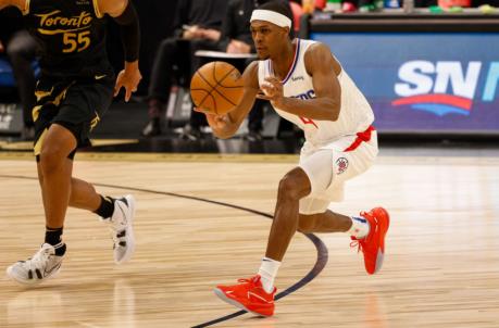 May 11, 2021; Tampa, Florida, USA; LA Clippers guard Rajon Ro<em></em>ndo (4) passes the ball in the third quarter in a game against the Toro<em></em>nto Raptors at Amalie Arena. Mandatory Credit: Nathan Ray Seebeck-USA TODAY Sports