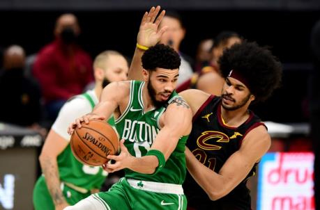 CLEVELAND, OHIO - MAY 12: Jayson Tatum #0 of the Boston Celtics drives against Jarrett Allen #31 of the Cleveland Cavaliers during their game at Rocket Mortgage Fieldhouse on May 12, 2021 in Cleveland, Ohio. The Cleveland Cavaliers won 102-94. NOTE TO USER: User expressly acknowledges and agrees that, by downloading and or using this photograph, User is co<em></em>nsenting to the terms and co<em></em>nditions of the Getty Images License Agreement. (Photo by Emilee Chinn/Getty Images)