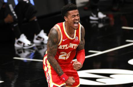 NEW YORK, NEW YORK - JANUARY 01: John Collins #20 of the Atlanta Hawks reacts after scoring during the second half against the Brooklyn Nets at Barclays Center on January 01, 2021 in the Brooklyn borough of New York City. The Hawks won 114-96. NOTE TO USER: User expressly acknowledges and agrees that, by downloading and/or using this Photograph, user is co<em></em>nsenting to the terms and co<em></em>nditions of the Getty Images License Agreement. (Photo by Sarah Stier/Getty Images)