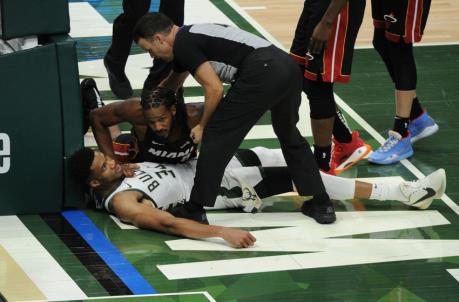 Miami Heat forward Trevor Ariza (8) pushes off of Milwaukee Bucks forward Giannis Antetokounmpo (34) as he gets up after fouling him
(Michael McLoone-USA TODAY Sports)