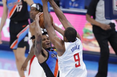 May 16, 2021; Oklahoma City, Oklahoma, USA; LA Clippers center Serge Ibaka (9) defends a shot by Oklahoma City Thunder forward Josh Hall (15) during the second quarter at Chesapeake Energy Arena. Mandatory Credit: Alo<em></em>nzo Adams-USA TODAY Sports