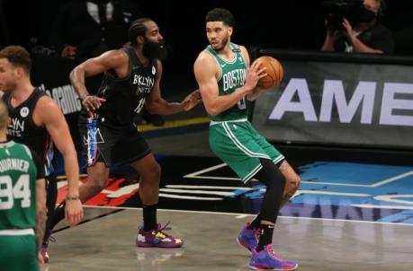 May 25, 2021; Brooklyn, New York, USA; Boston Celtics small forward Jayson Tatum (0) plays the ball against Brooklyn Nets shooting guard James Harden (13) during the third quarter of game two of the first round of the 2021 NBA Playoffs at Barclays Center. Mandatory Credit: Brad Penner-USA TODAY Sports