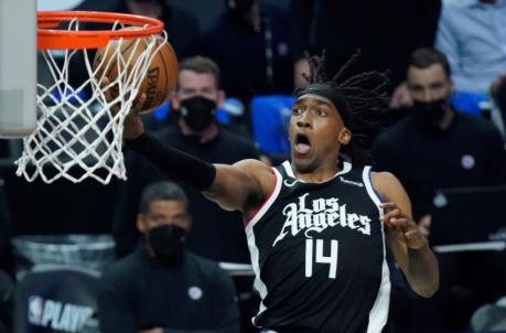 LA Clippers guard Terance Mann (14) scores on a breakaway during the third quarter. Mandatory Credit: Robert Hanashiro-USA TODAY Sports