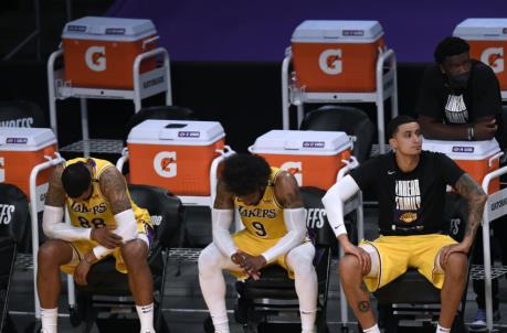 LOS ANGELES, CALIFORNIA - JUNE 03: Markieff Morris #88, Wesley Matthews #9 and Kyle Kuzma #0 of the Los Angeles Lakers react in a 113-100 Phoenix Suns win during game six of the Western Co<em></em>nference first round series at Staples Center on June 03, 2021 in Los Angeles, California. (Photo by Harry How/Getty Images) NOTE TO USER: User expressly acknowledges and agrees that, by downloading and or using this photograph, User is co<em></em>nsenting to the terms and co<em></em>nditions of the Getty Images License Agreement.