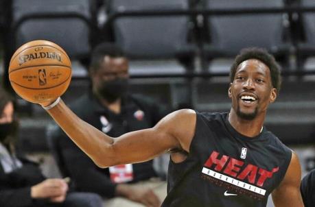 Bam Adebayo #13 of the Miami Heat goes through workouts before the start of a game
(Photo by Ro<em></em>nald Cortes/Getty Images)