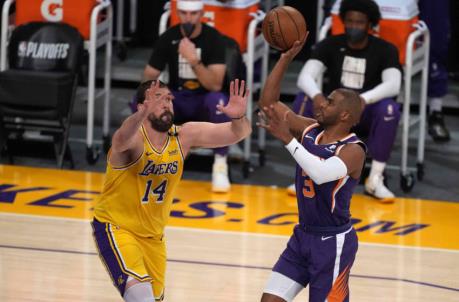 Jun 3, 2021; Los Angeles, California, USA; Phoenix Suns guard Chris Paul (3) is defended by Los Angeles Lakers center Marc Gasol (14) in the first quarter during game six in the first round of the 2021 NBA Playoffs. at Staples Center. Mandatory Credit: Kirby Lee-USA TODAY Sports