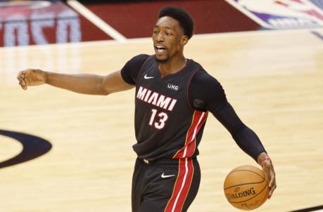 MIAMI, FLORIDA - DECEMBER 29: Bam Adebayo #13 of the Miami Heat reacts against the Milwaukee Bucks during the first quarter at American Airlines Arena on December 29, 2020 in Miami, Florida. NOTE TO USER: User expressly acknowledges and agrees that, by downloading and or using this photograph, User is co<em></em>nsenting to the terms and co<em></em>nditions of the Getty Images License Agreement. (Photo by Michael Reaves/Getty Images)