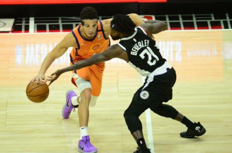 Phoenix Suns guard Devin Booker (1) moves the ball against Los Angeles Clippers guard Patrick Beverley (21). Mandatory Credit: Gary A. Vasquez-USA TODAY Sports