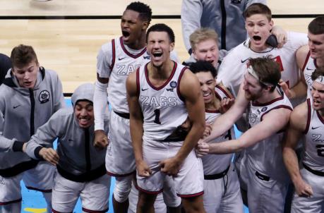 INDIANAPOLIS, INDIANA - APRIL 03: Jalen Suggs #1 of the Go<em></em>nzaga Bulldogs celebrates with teammates after making a game-winning three point basket in overtime to defeat the UCLA Bruins 93-90 during the 2021 NCAA Final Four semifinal at Lucas Oil Stadium on April 03, 2021 in Indianapolis, Indiana. (Photo by Andy Lyons/Getty Images)