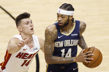 MIAMI, FLORIDA - DECEMBER 14: Brandon Ingram #14 of the New Orleans Pelicans is defended by Tyler Herro #14 of the Miami Heat during a preseason game at American Airlines Arena on December 14, 2020 in Miami, Florida. NOTE TO USER: User expressly acknowledges and agrees that, by downloading and or using this photograph, User is co<em></em>nsenting to the terms and co<em></em>nditions of the Getty Images License Agreement. (Photo by Michael Reaves/Getty Images)