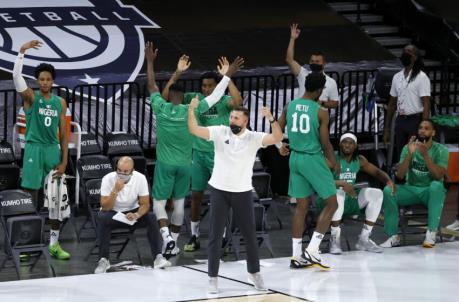 LAS VEGAS, NEVADA - JULY 10: The Nigeria bench reacts after Ike Iroegbu #1 of Nigeria hit a 3-pointer against the United States in the fourth quarter of an exhibition game at Michelob ULTRA Arena ahead of the Tokyo Olympic Games on July 10, 2021 in Las Vegas, Nevada. Nigeria defeated the United States 90-87. (Photo by Ethan Miller/Getty Images)