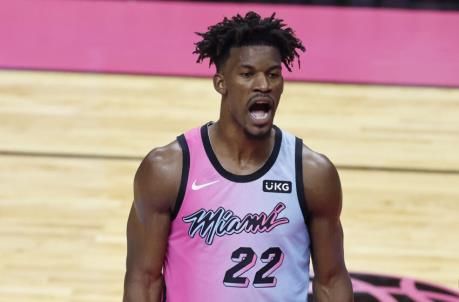 MIAMI, FLORIDA - FEBRUARY 24: Jimmy Butler #22 of the Miami Heat reacts against the Toro<em></em>nto Raptors during the third quarter at American Airlines Arena on February 24, 2021 in Miami, Florida. NOTE TO USER: User expressly acknowledges and agrees that, by downloading and or using this photograph, User is co<em></em>nsenting to the terms and co<em></em>nditions of the Getty Images License Agreement. (Photo by Michael Reaves/Getty Images)