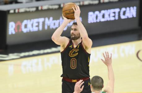 May 12, 2021; Cleveland, Ohio, USA; Cleveland Cavaliers forward Kevin Love (0) makes a three-point basket in the fourth quarter against the Boston Celtics at Rocket Mortgage FieldHouse. Mandatory Credit: David Richard-USA TODAY Sports