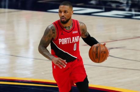 May 22, 2021; Denver, Colorado, USA; Portland Trail Blazers guard Damian Lillard (0) controls the ball against the Denver Nuggets during the third quarter during game one in the first round of the 2021 NBA Playoffs at Ball Arena. Mandatory Credit: Ron Chenoy-USA TODAY Sports