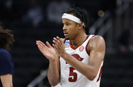 INDIANAPOLIS, INDIANA - MARCH 27: Moses Moody #5 of the Arkansas Razorbacks reacts after a call against the Oral Roberts Golden Eagles during the second half in the Sweet Sixteen round of the 2021 NCAA Men's Basketball Tournament at Bankers Life Fieldhouse on March 27, 2021 in Indianapolis, Indiana. (Photo by Tim Nwachukwu/Getty Images)