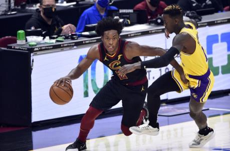 Jan 25, 2021; Cleveland, Ohio, USA; Cleveland Cavaliers guard Collin Sexton (2) drives against Los Angeles Lakers guard Dennis Schroder (17) in the first quarter at Rocket Mortgage FieldHouse. Mandatory Credit: David Richard-USA TODAY Sports