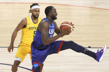 LAS VEGAS, NEVADA - JULY 12: Draymond Green #14 of the United States catches a pass against Patty Mills #5 of the Australia Boomers during an exhibition game at Michelob Ultra Arena ahead of the Tokyo Olympic Games on July 12, 2021 in Las Vegas, Nevada. (Photo by Ethan Miller/Getty Images)