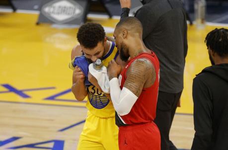 SAN FRANCISCO, CALIFORNIA - JANUARY 03: Stephen Curry #30 of the Golden State Warriors is co<em></em>ngratulated by Damian Lillard #0 of the Portland Trail Blazers after Curry scored a career-high 62 points against the Portland Trail Blazers at Chase Center on January 03, 2021 in San Francisco, California. NOTE TO USER: User expressly acknowledges and agrees that, by downloading and or using this photograph, User is co<em></em>nsenting to the terms and co<em></em>nditions of the Getty Images License Agreement. (Photo by Ezra Shaw/undefined)