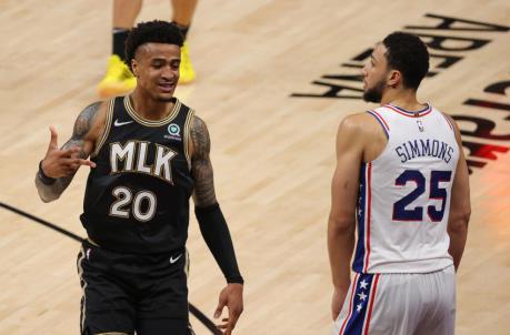 ATLANTA, GEORGIA - JUNE 14: John Collins #20 of the Atlanta Hawks reacts after hitting a three-point basket against Ben Simmons #25 of the Philadelphia 76ers during the second half of game 4 of the Eastern Co<em></em>nference Semifinals at State Farm Arena on June 14, 2021 in Atlanta, Georgia. NOTE TO USER: User expressly acknowledges and agrees that, by downloading and or using this photograph, User is co<em></em>nsenting to the terms and co<em></em>nditions of the Getty Images License Agreement. (Photo by Kevin C. Cox/Getty Images)