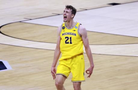 INDIANAPOLIS, INDIANA - MARCH 22: Franz Wagner #21 of the Michigan Wolverines celebrates a three-pointer against the LSU Tigers during the second half in the NCAA Basketball Tournament second round at Lucas Oil Stadium on March 22, 2021 in Indianapolis, Indiana. (Photo by Justin Casterline/Getty Images)