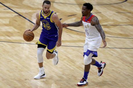 NEW ORLEANS, LOUISIANA - MAY 04: Stephen Curry #30 of the Golden State Warriors is defneded by Eric Bledsoe #5 of the New Orleans Pelicans during the first quarter of an NBA game at Smoothie King Center on May 04, 2021 in New Orleans, Louisiana. NOTE TO USER: User expressly acknowledges and agrees that, by downloading and or using this photograph, User is co<em></em>nsenting to the terms and co<em></em>nditions of the Getty Images License Agreement. (Photo by Sean Gardner/Getty Images)