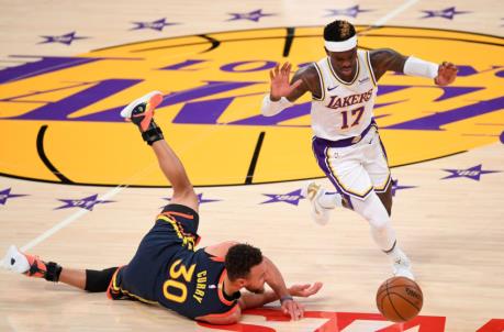 Feb 28, 2021; Los Angeles, California, USA; Golden State Warriors guard Stephen Curry (30) gets tangled with Los Angeles Lakers guard Dennis Schroder (17) as he takes the ball down court in the first quarter at Staples Center. Mandatory Credit: Jayne Kamin-Oncea-USA TODAY Sports