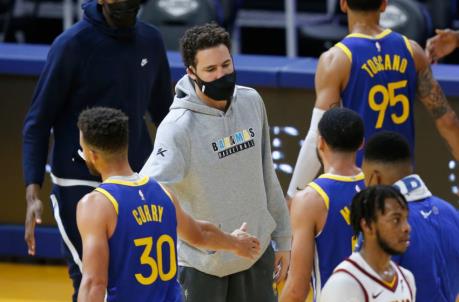 SAN FRANCISCO, CALIFORNIA - FEBRUARY 15: Klay Thompson #11 of the Golden State Warriors greets teammates during a time out in the third quarter against the Cleveland Cavaliers at Chase Center on February 15, 2021 in San Francisco, California. NOTE TO USER: User expressly acknowledges and agrees that, by downloading and/or using this photograph, user is co<em></em>nsenting to the terms and co<em></em>nditions of the Getty Images License Agreement. (Photo by Lachlan Cunningham/Getty Images)