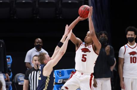 INDIANAPOLIS, INDIANA - MARCH 27: Moses Moody #5 of the Arkansas Razorbacks takes a shot over Francis Lacis #22 of the Oral Roberts Golden Eagles during the second half in the Sweet Sixteen round of the 2021 NCAA Men's Basketball Tournament at Bankers Life Fieldhouse on March 27, 2021 in Indianapolis, Indiana. (Photo by Justin Casterline/Getty Images)