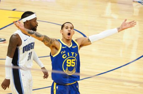 Feb 11, 2021; San Francisco, California, USA; Golden State Warriors forward Juan Toscano-Anderson (95) celebrates after a basket ahead of Orlando Magic guard-forward Terrence Ross (31) during the fourth quarter at Chase Center. Mandatory Credit: Kelley L Cox-USA TODAY Sports