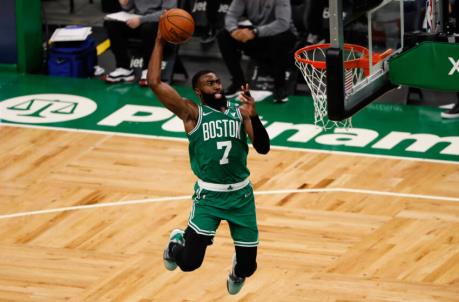 Apr 7, 2021; Boston, Massachusetts, USA; Boston Celtics guard Jaylen Brown (7) goes in for a dunk during the fourth quarter against the New York Knicks at TD Garden. Mandatory Credit: Winslow Townson-USA TODAY Sports