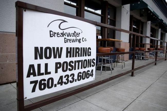 A restaurant advertising jobs looks to attract workers in Oceanside, California